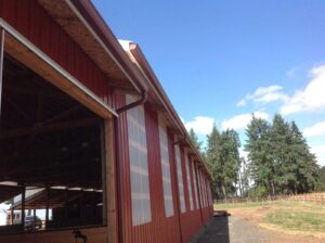 A Farm Colonial Red Gutter Installation by Oregon Gutter Service in Albany, Oregon