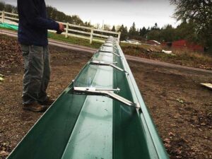 A Outbuilding Forest Green Gutter Guard Installation by Oregon Gutter Service in Corvallis, Oregon