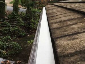 A Residential Pebble Stone Clay Gutter Installation by Oregon Gutter Service in Corvallis, Oregon