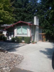 A Residential Colonial Red Gutter Installation by Oregon Gutter Service in Lebanon, Oregon