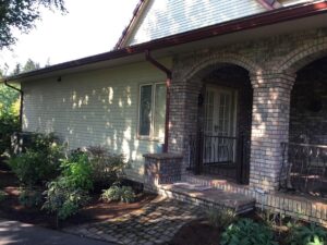 A Residential Colonial Red Gutter Installation by Oregon Gutter Service in Portland, Oregon